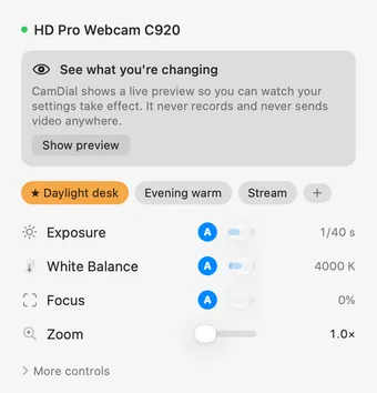 CamDial’s menu-bar popover for a Logitech C920: Daylight desk, Evening warm and Stream preset chips above rows for Exposure at 1/40 s, White Balance at 4000 K, Focus and Zoom at 1.0×.